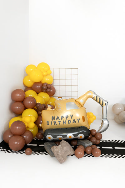 Ballon Pelleteuse autoportane en foil jaune et noir 49x76,5 cm